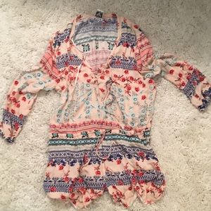 Floral print romper; never worn