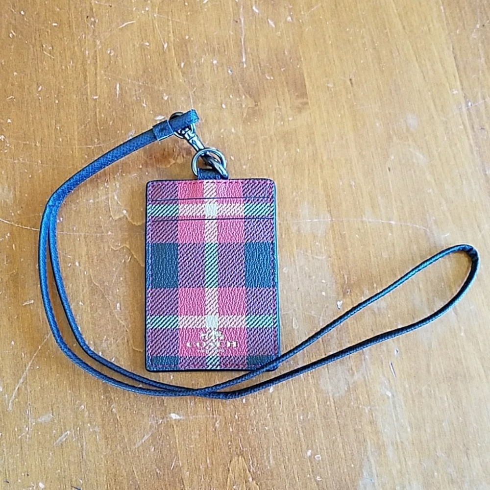 Coach leather ID holder on lanyard.