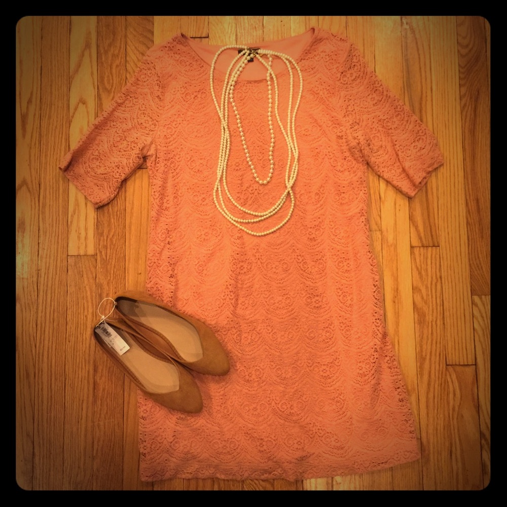Lace peach colored dress.