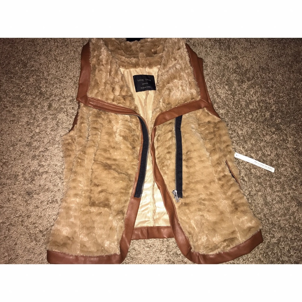 Faux vest, with tag.