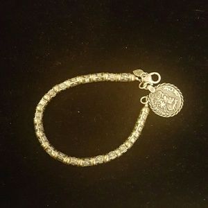 Sterling silver and brass coin bracelet