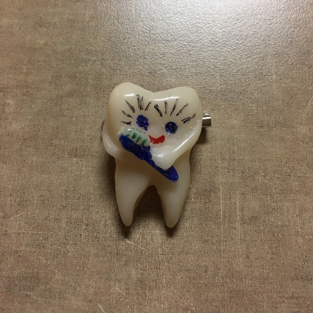 Hand crafted tooth pendant