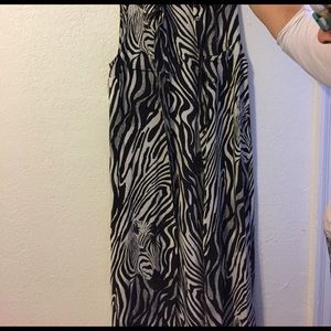 It is a button up %100 silk dress