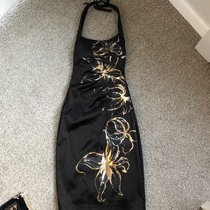 Black and gold floral patterned cocktail dress