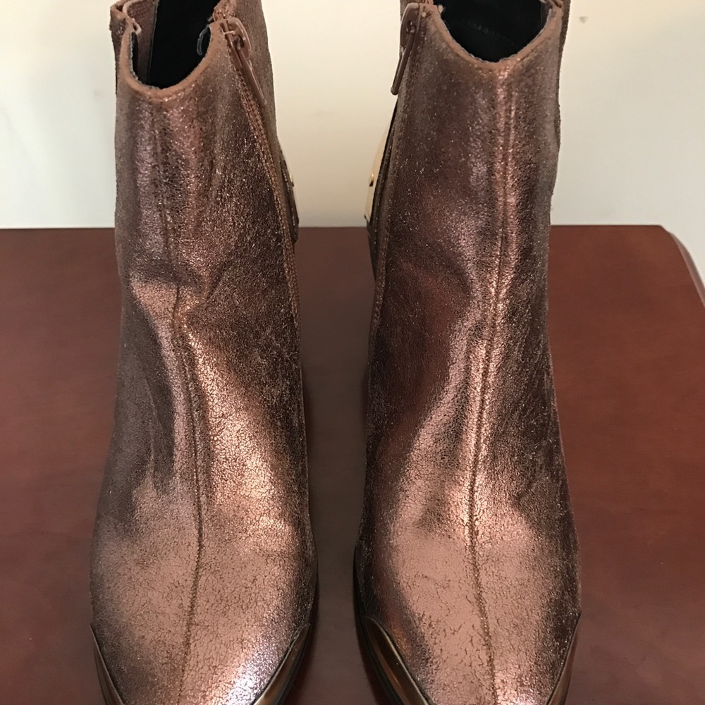 Bronze with "Accents of Gold."