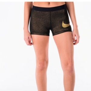 Gold Nike pro compression shorts
