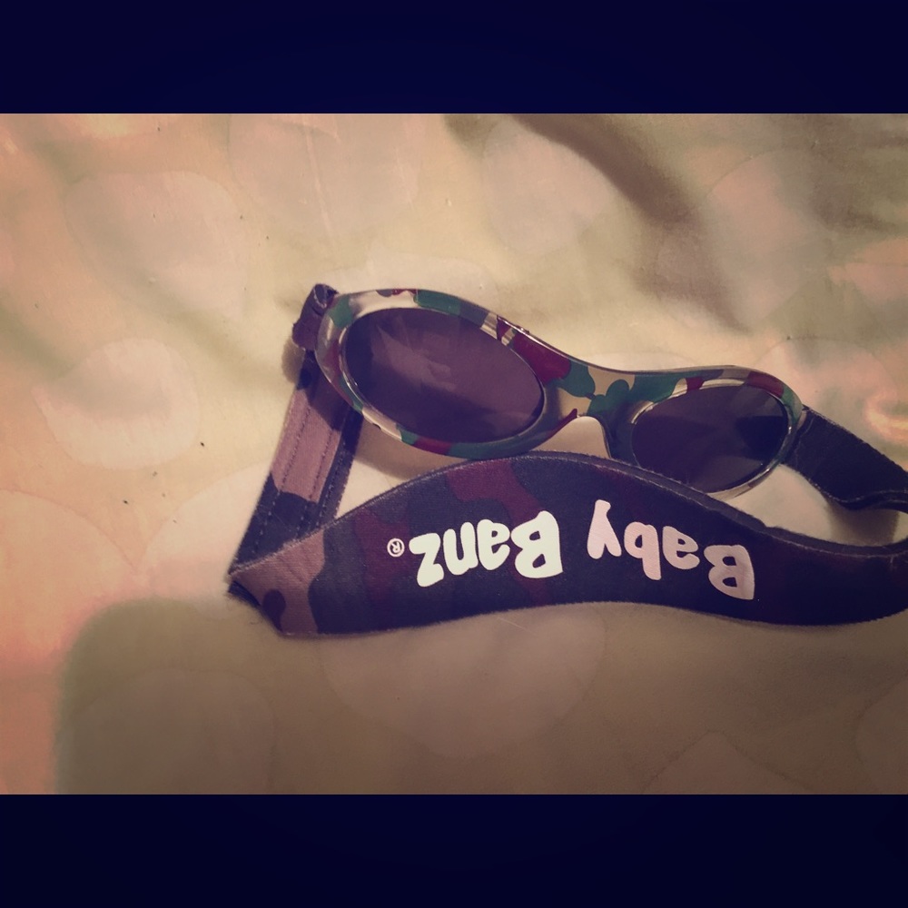 Baby Banz green camo infant sun glasses.
