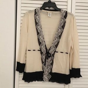 Beige sweater with black crochet and lace trim