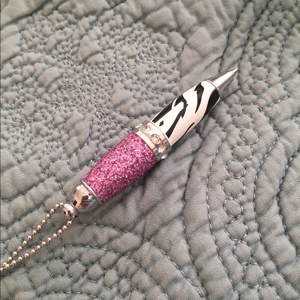 zebra and pink pen on long chain