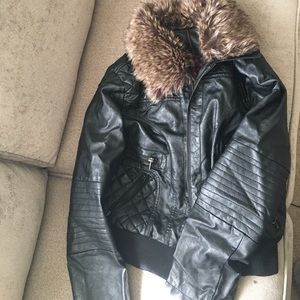 Women's biker jacket with fur trim.