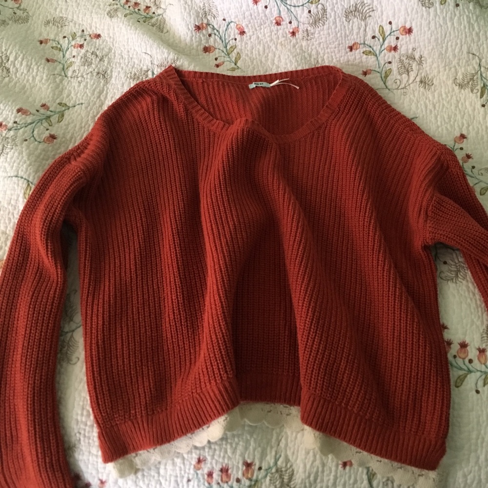 Orange sweater with lace lining