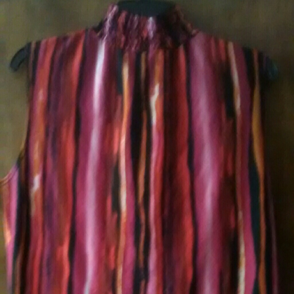 Striped multi-colored sleeveless turtleneck shirt