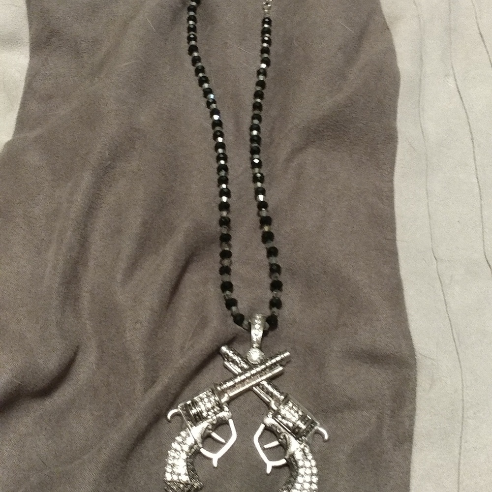 Double pistol necklace.