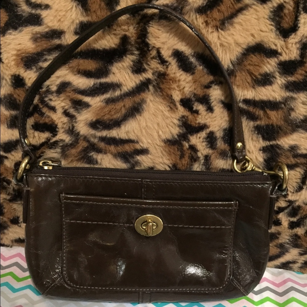Gently used brown patent coach wristlet