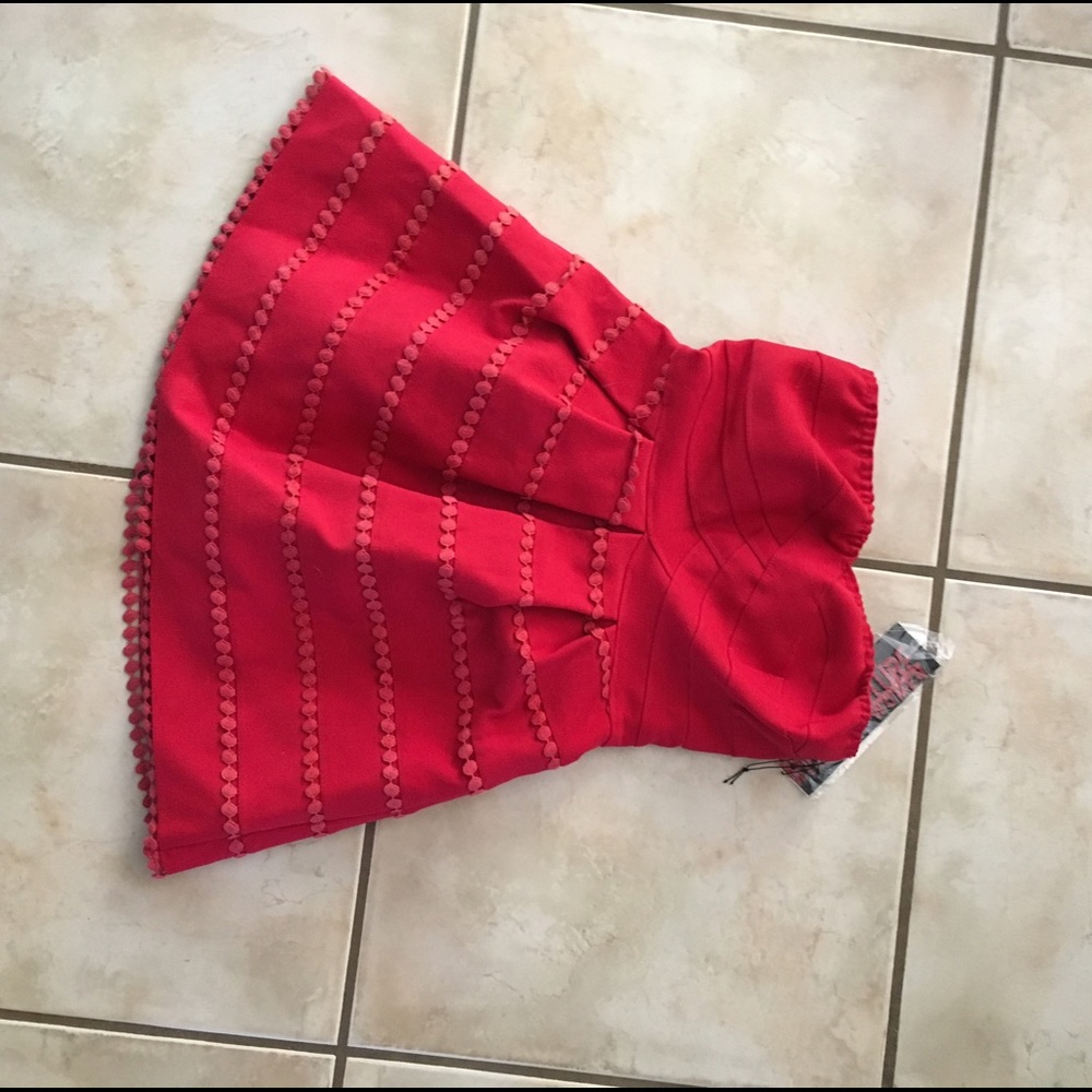 Strapless red dress with detailing
