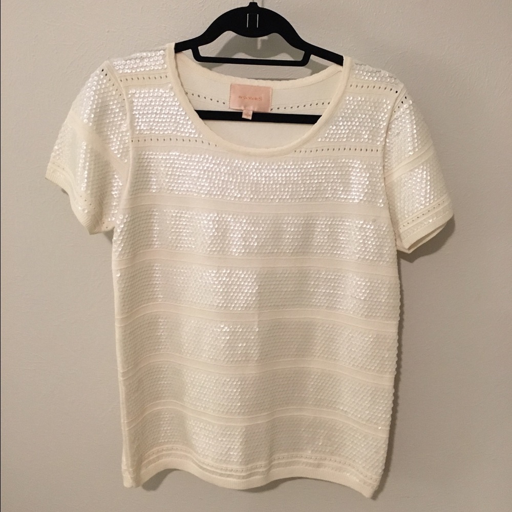 Ivory sequined sweater blouse.