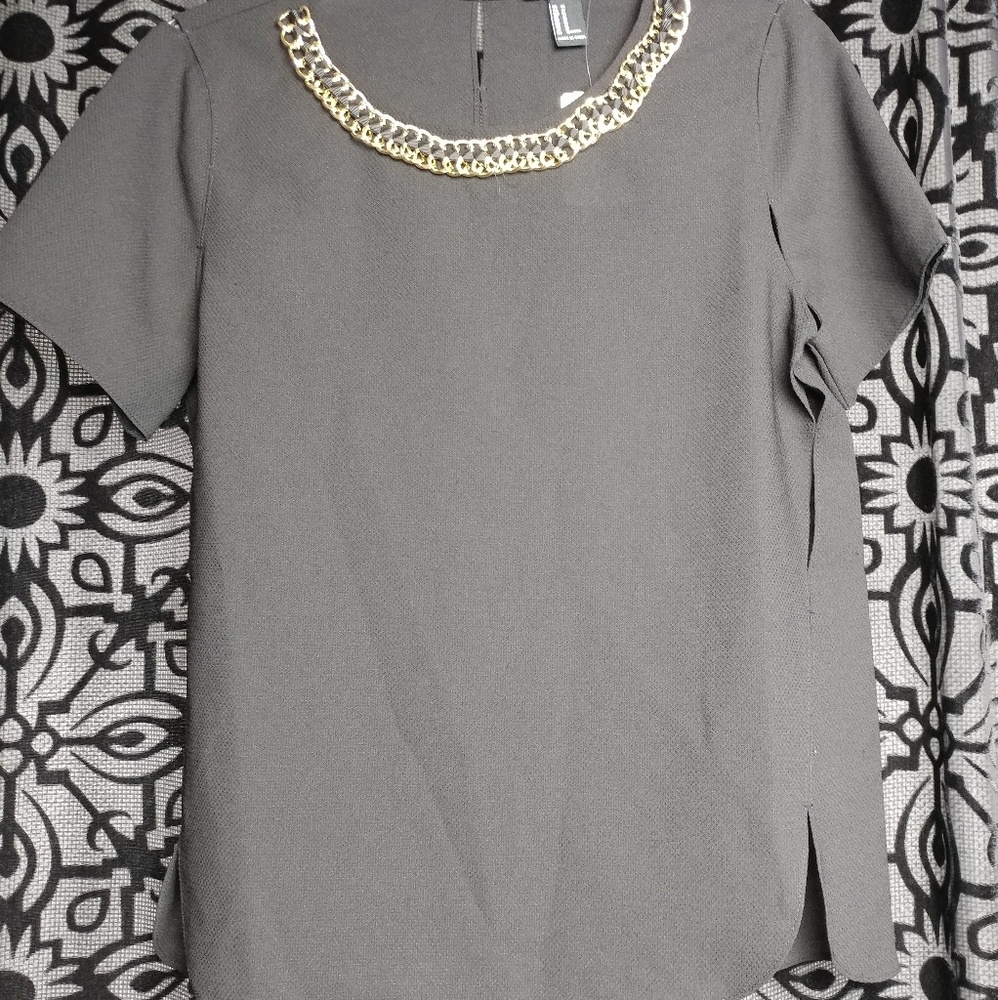 Black top with gold embellishments