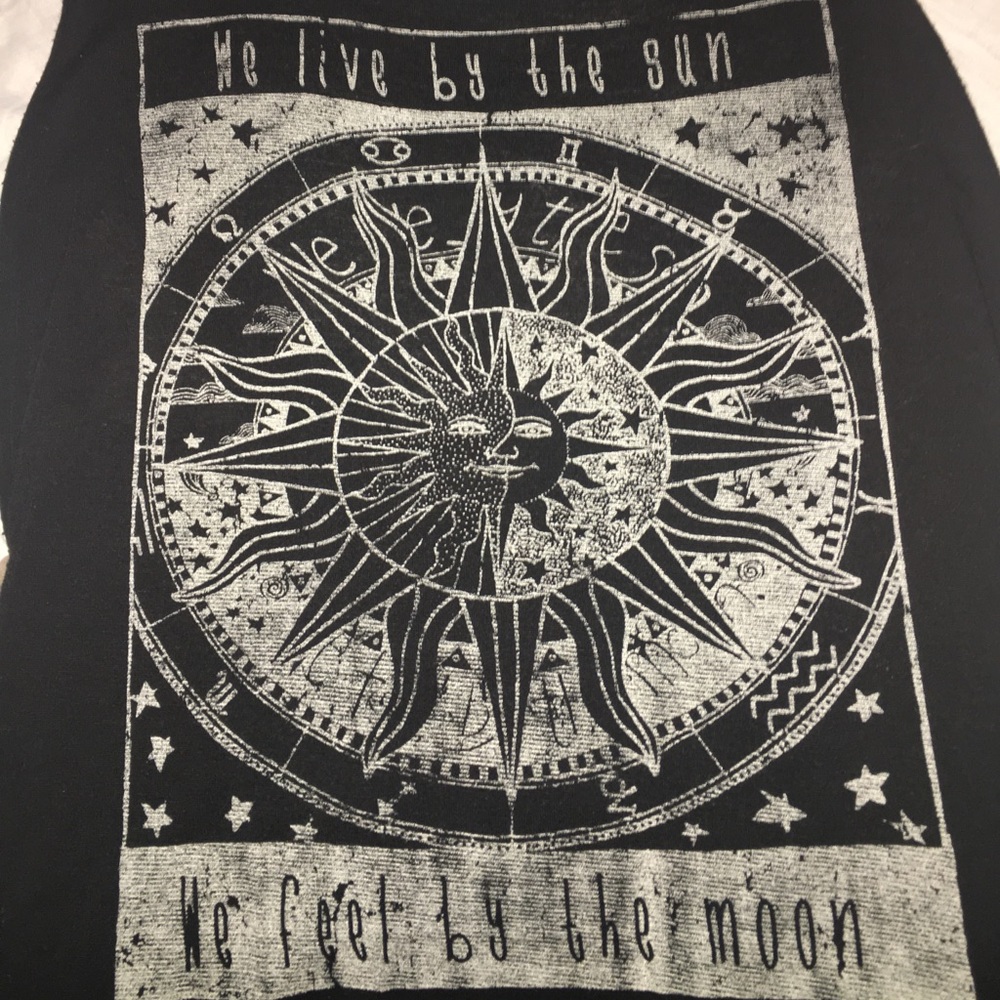 "We live by the sun, feel by the moon" tank top