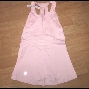 Size 4 light pink LuLuLemon top. Top back is mesh