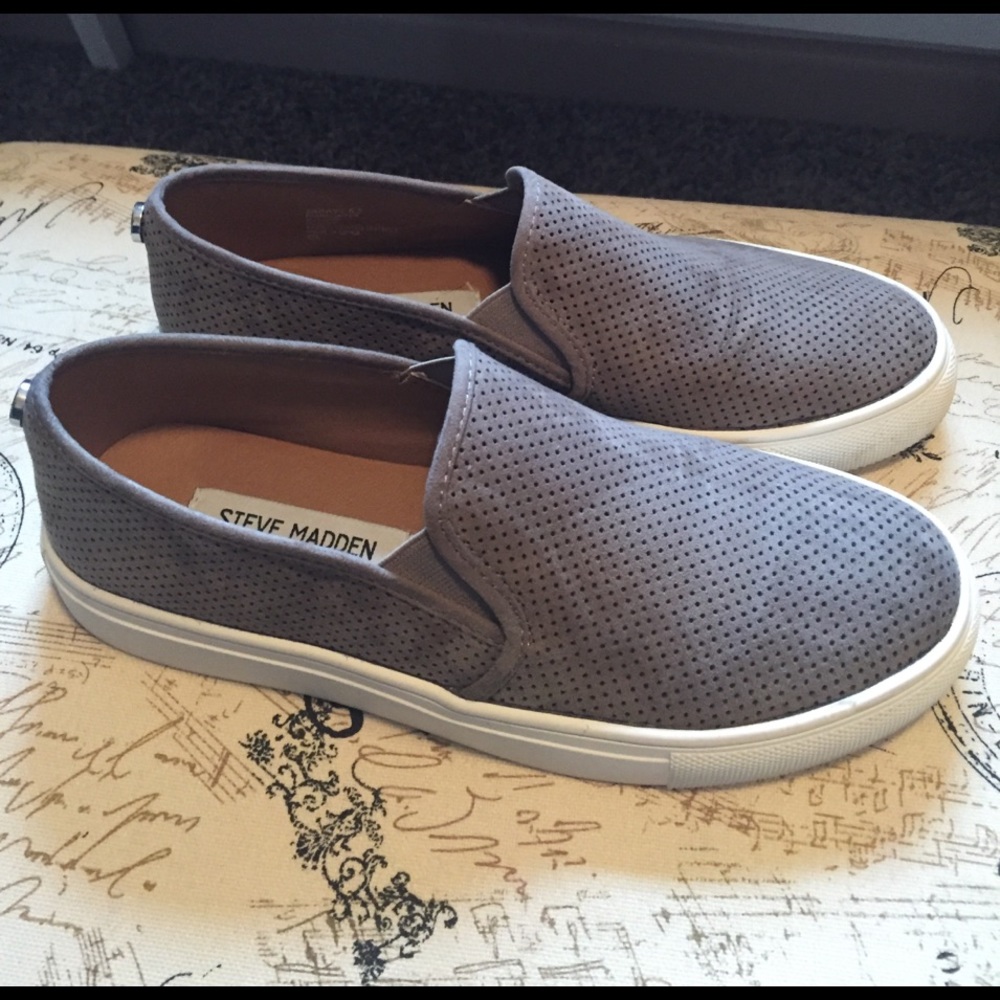 Grey suede perforated slip ons