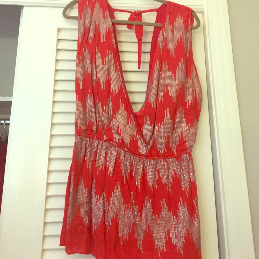 Red sleeveless shirt with silver sequins