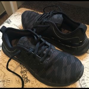 Black UA athletic shoes