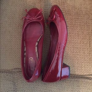 Coach, low healed dress shoe.