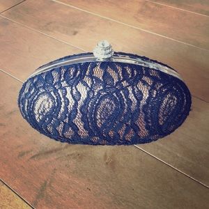 Rose gold and black lace clutch