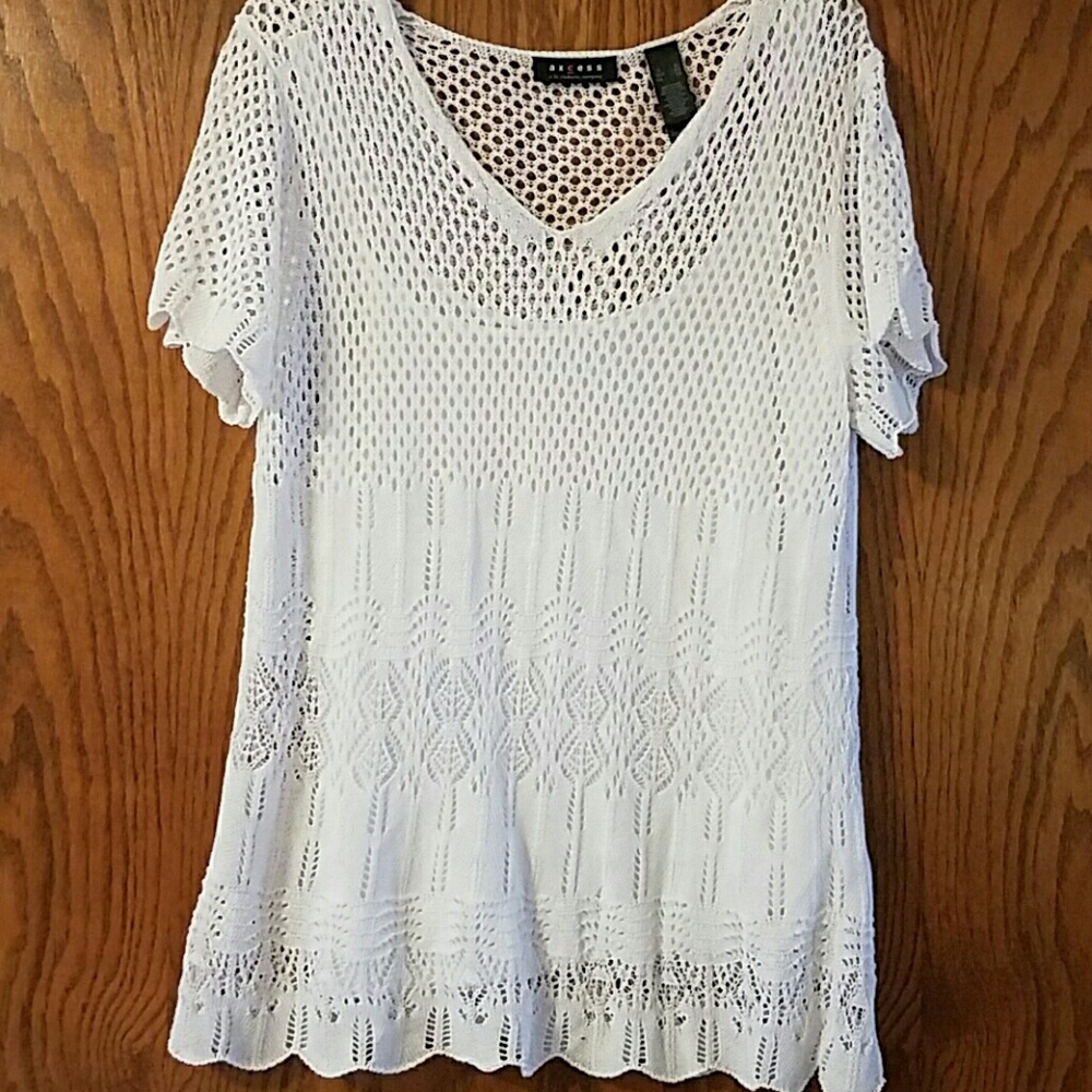 White knit top with white tank under.