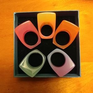 Tropical colored lucite-like rings