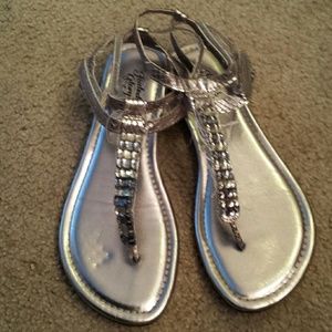 Silver strappy sandals with rhinestones.