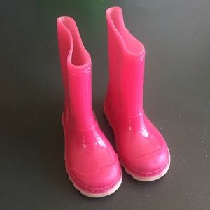 Cute pink rubber rain boots for your baby girl.