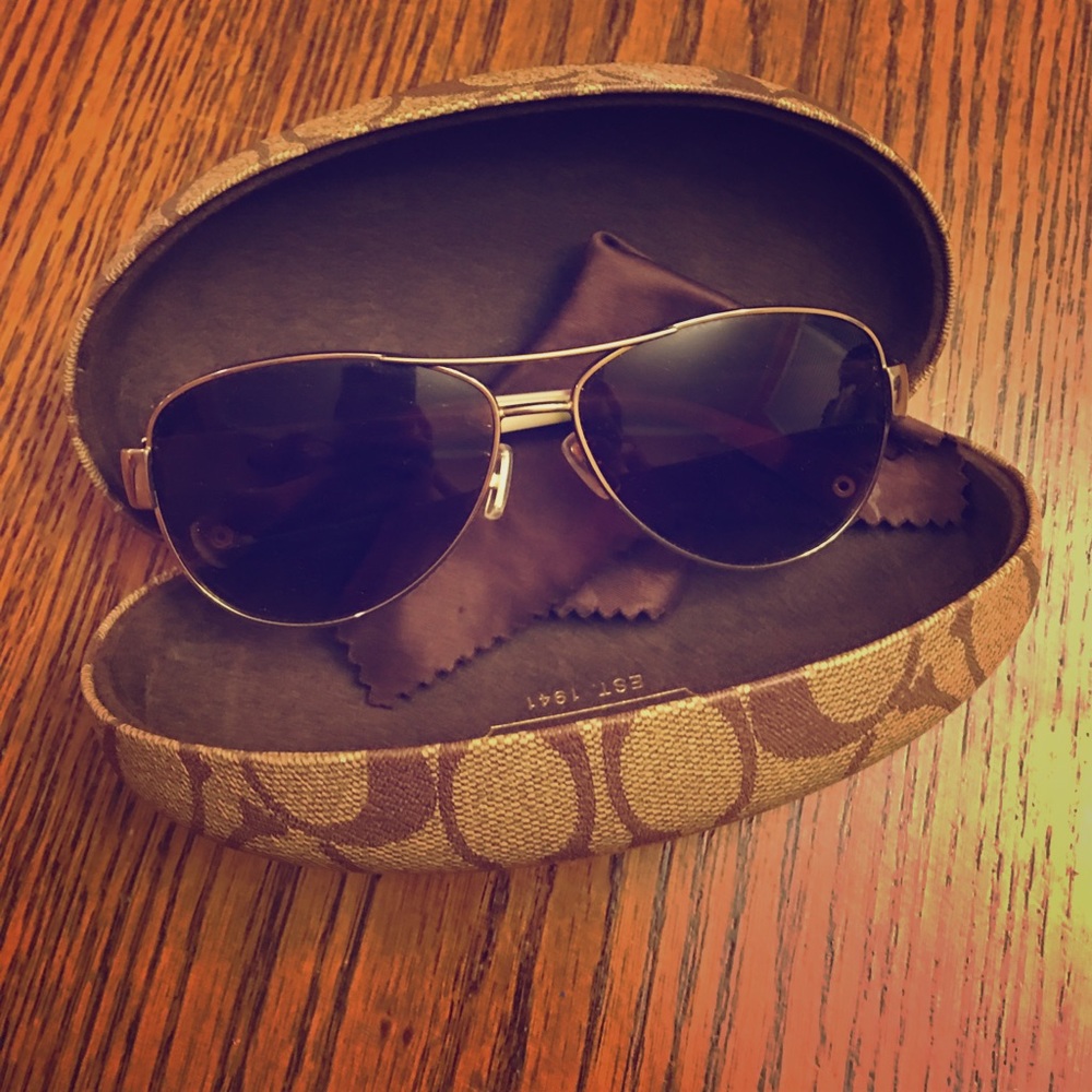 Very very gently used Coach aviator sunglasses.