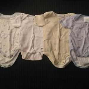 Four newborn short sleeve onsies