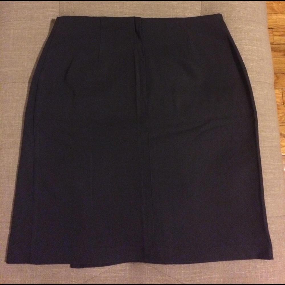 Dark grey knee length skirt.