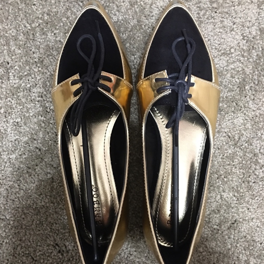 Black and gold loafers