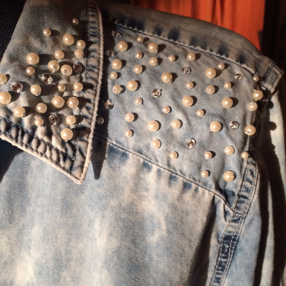 Pearl and glitz on this acid washed denim top.