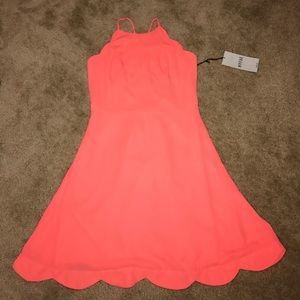 Super cute dress with strappy detail in back!