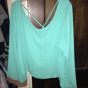 Open back teal blouse