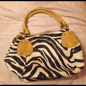 Zebra print with yellow purse