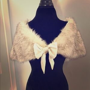Women's faux fur shrug with bow detail