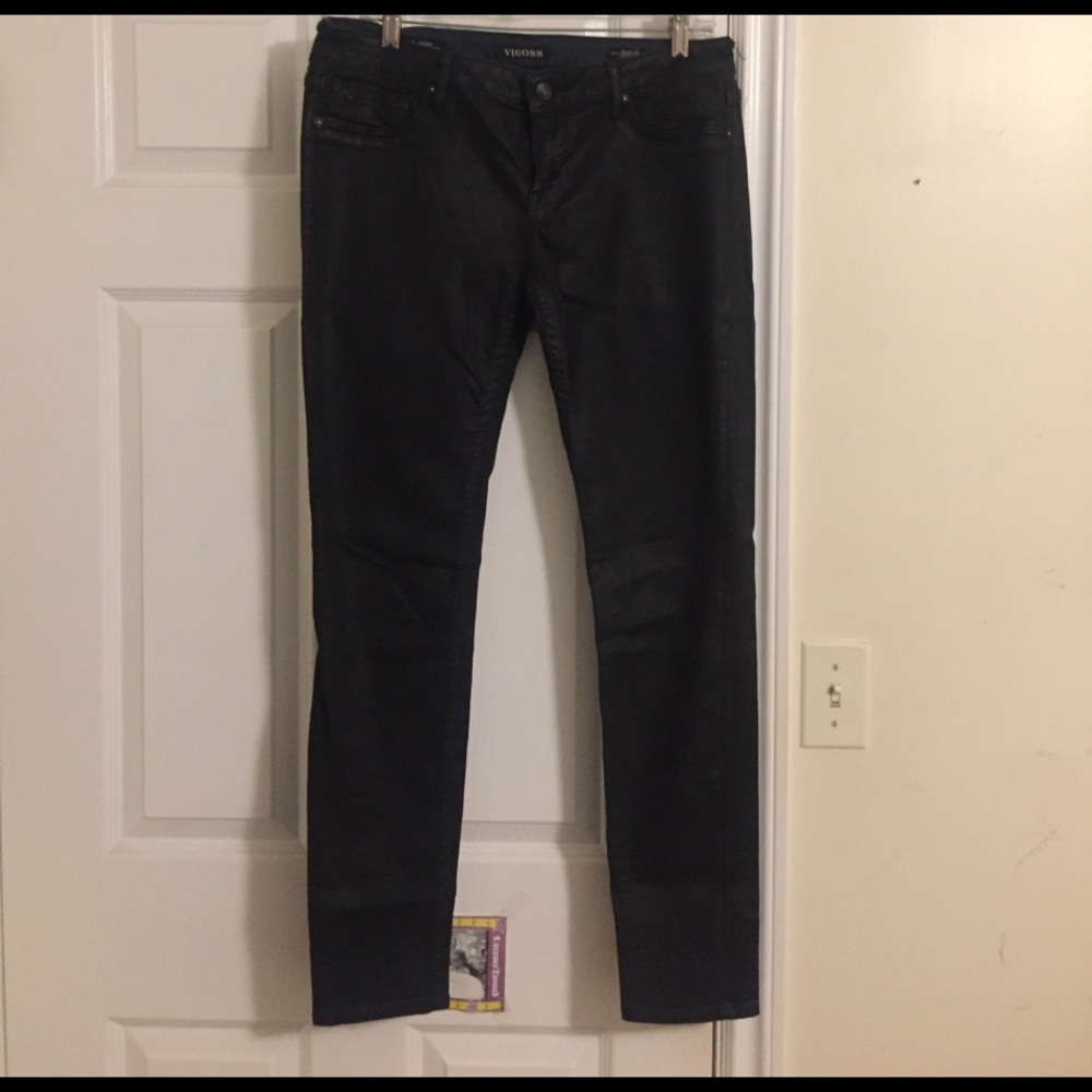 Wax coated black skinny jeans