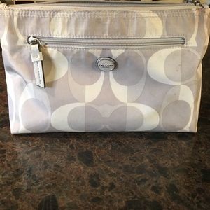 Coach makeup case length 9.5' height 7'.