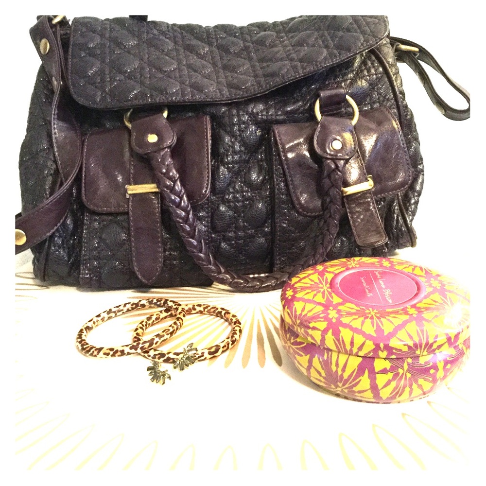 Purple quilted messenger bag.