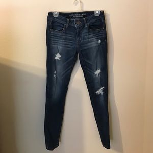 Ripped blue jean jeggings