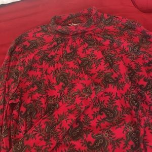 Red turtleneck top with pattern