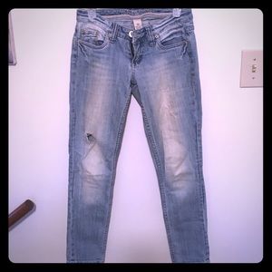 Light blue faded skinny jeans.