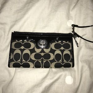 Black and grey coach wristlet