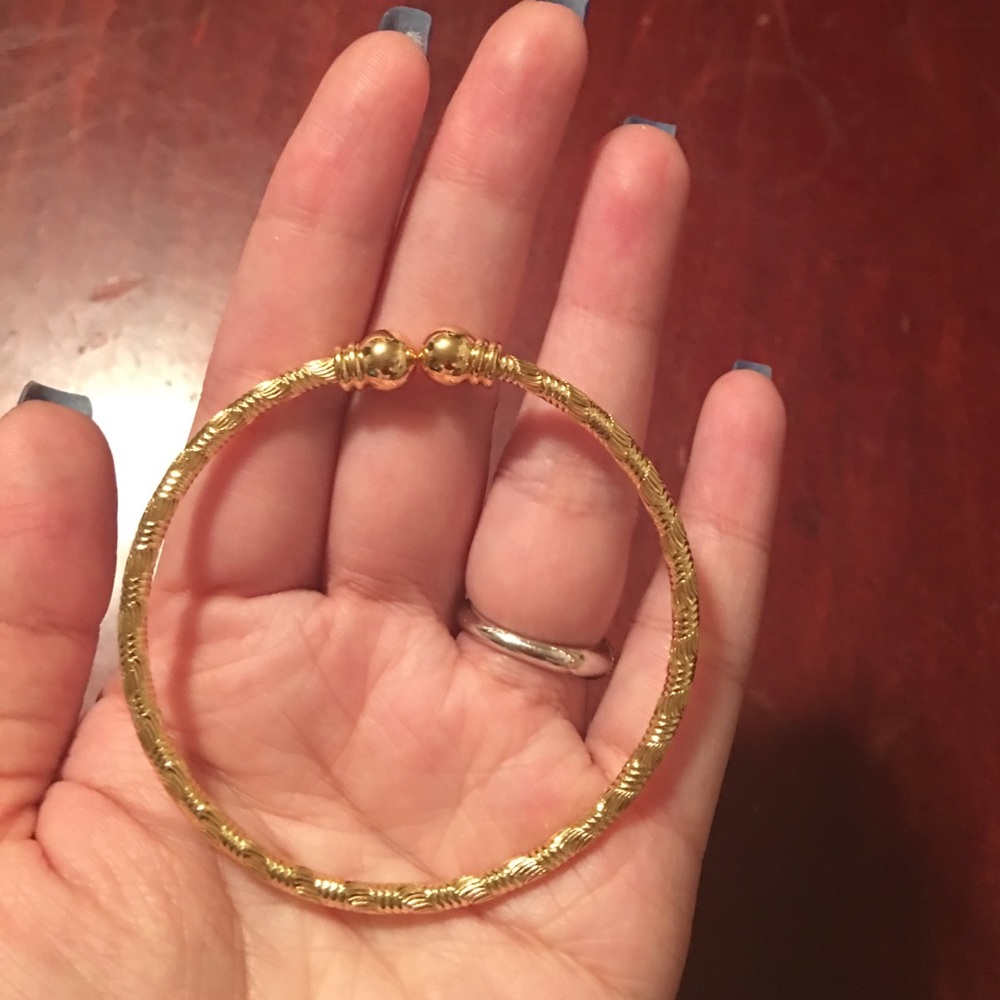 Gold plated bangle bracelet.