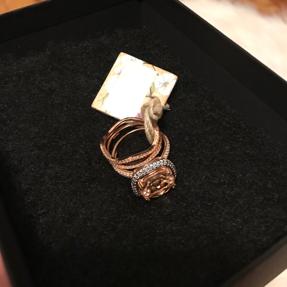Rose gold peach gem stacked rings.